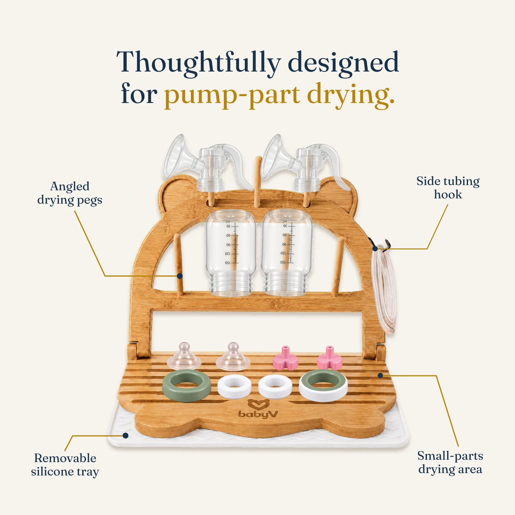 PumpDry bamboo rack feature view identifying angled drying pegs, side tubing hook, removable silicone tray, and small-parts drying area